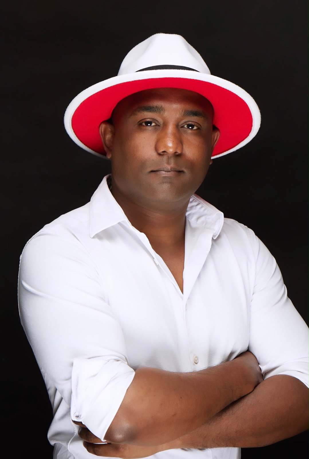 DJ Ricardo Lima — portrait in white fedora