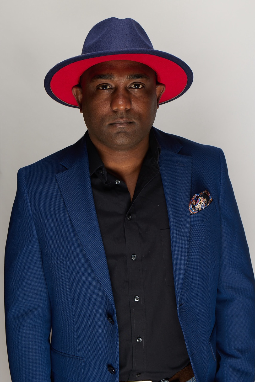 DJ Ricardo Lima — navy fedora and blue blazer