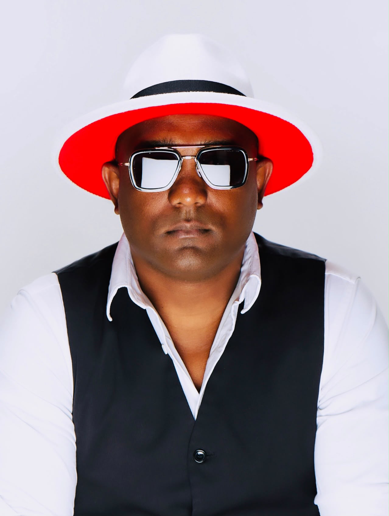 DJ Ricardo Lima — white fedora and sunglasses