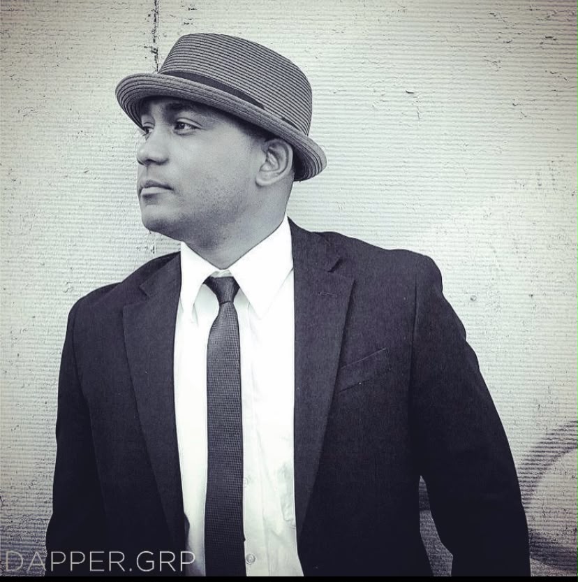 DJ Ricardo Lima — black and white suit portrait
